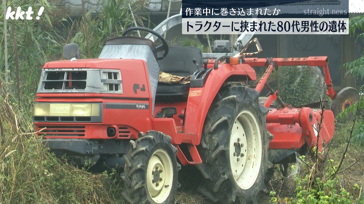 男性が挟まれたトラクター